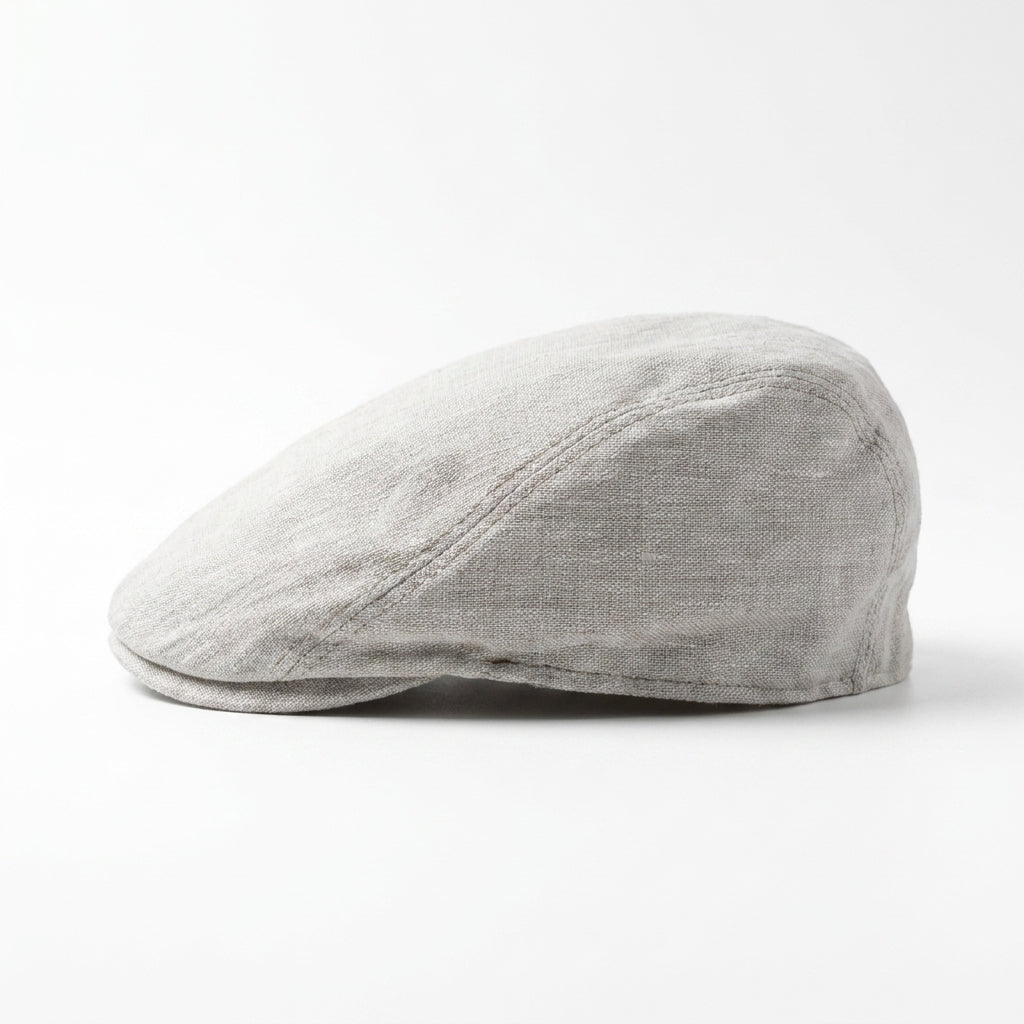 Beigefarbene Flatcap aus Leinen linke Seitenansicht