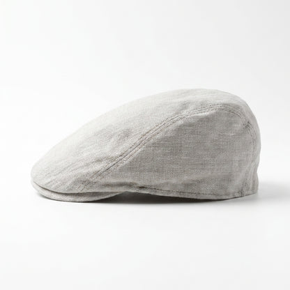 Beigefarbene Flatcap aus Leinen linke Seitenansicht